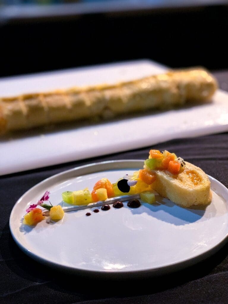 Fruit roulade with tropical fruits and berry emulsion